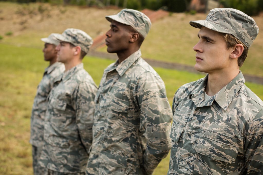 A group of diverse US army soldiers standing in a line.